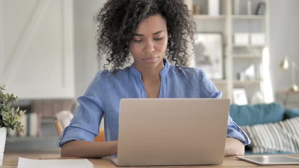 African Woman Working on Laptop