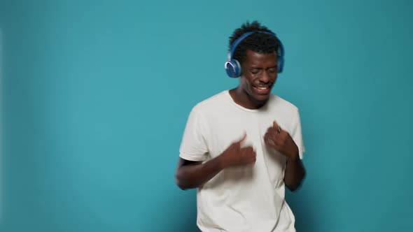 Portrait of Joyful Person Wearing Headphones and Having Fun