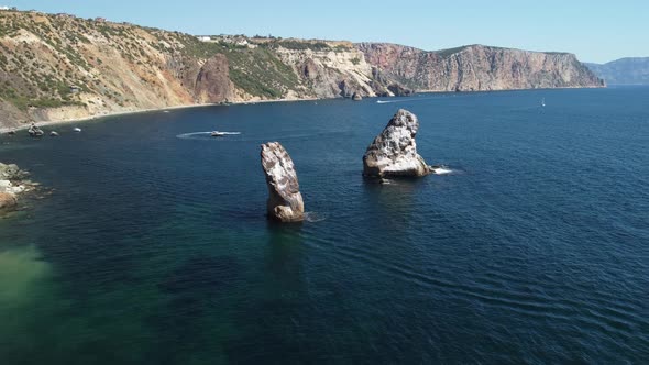 Aerial View From Above on Calm Azure Sea and Volcanic Rocky Shores