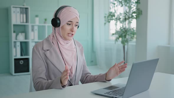 Arab Girl in Pink Hijab Businesswoman Islamic Help Line Manager Muslim Woman in Headphones Agent of