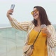 Beautiful happy young plus size woman 30-35 years old on vacation makes a selfie - VideoHive Item for Sale