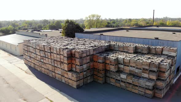 Warehouses. Stacks of Wooden Crates for Fruit, Large Boxes for Apples Stand Outdoors, on Warehouse