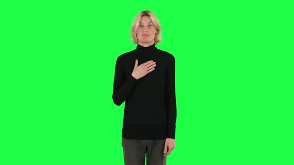 Blonde Guy Indignantly Talking To Someone, Looking at the Camera. Green Screen