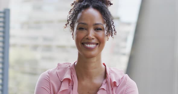 Portrait of happy african american businesswoman in creative office