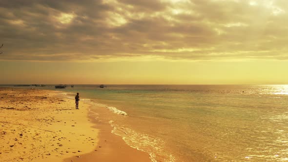 Angling for cute teenager on holiday enjoying activities on beach on paradise white sand and blue ba