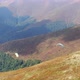 Two Paragliders Fly Over Mountain - VideoHive Item for Sale