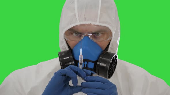 Medical Research, Coronavirus Vaccine A Man in a Protective Suit, in a Mask and a Respirator