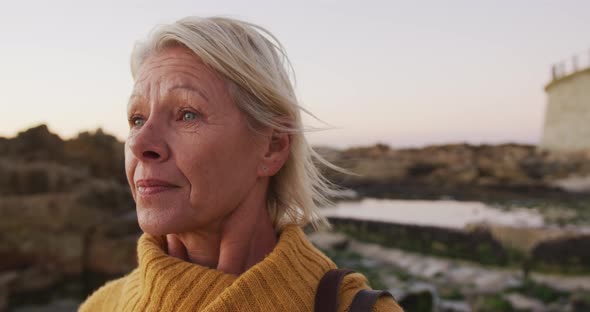 Side view of senior woman at beach