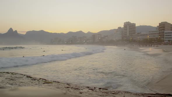 Slow motion pan from a beach in Rio de Janeiro to Atlantic Ocean