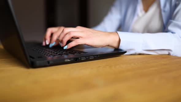 Slow motion Unrecognizable Businesswoman female hands using typing on laptop