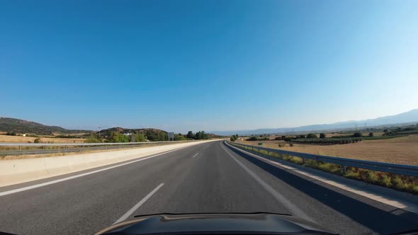 Summer Road Trip on Europe Firstperson View of a Moving Car on a Highway Blue Sky