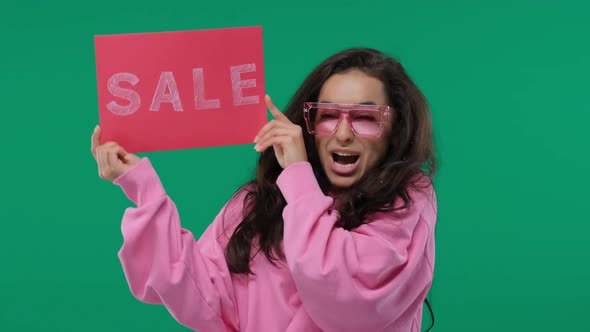 Shopping Sale Woman Showing Shopping Sign with Sale Written. Beautiful Smiling Asian Woman Showing