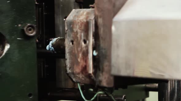 Old Rusty CNC Machine applying Sticky Liquid Plastic.