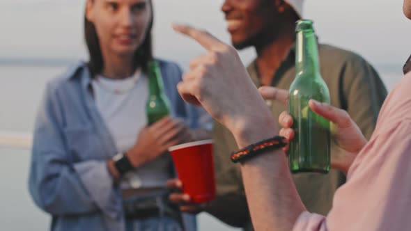 Cropped Guy with Beer on Lake Party