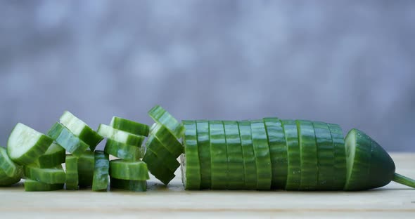 Chopping Cucumber Close Up on Wooden Board