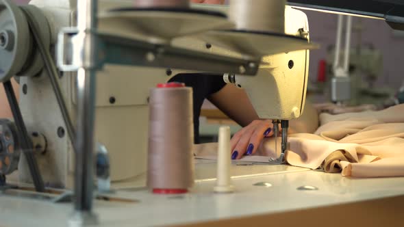 Female Sewing with Industrial Sewing Machine
