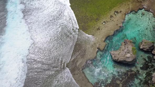 Aerial dolly over Magpupungko Rock Pools at high tide at Siargao, the Philippines