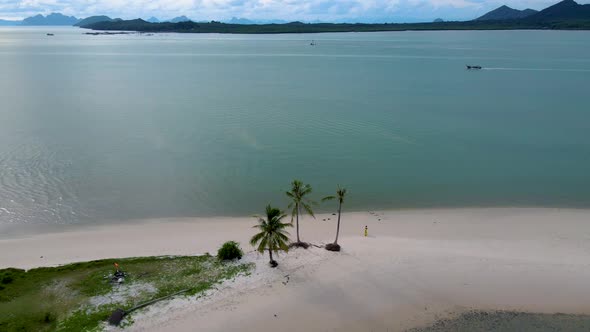 Couple Men and Women Walking on the Beach at the Island Koh Yao Yai Thailand Beach with White Sand