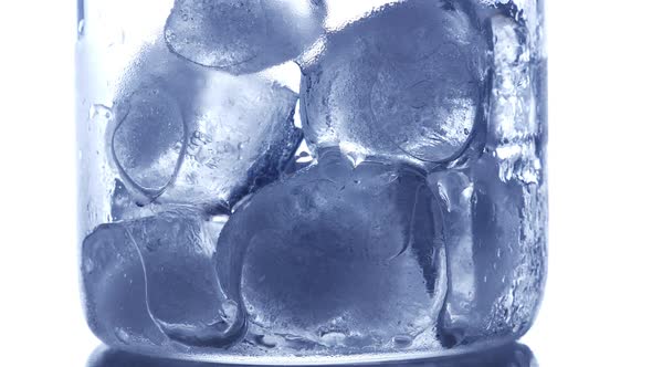 Ice Cubes Melting in Drinking Glass