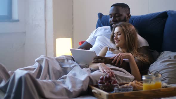 Loving Couple Communicating Watching Video