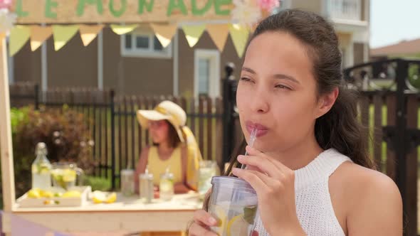 Attractive Woman Drinking Lemonade Outdoors