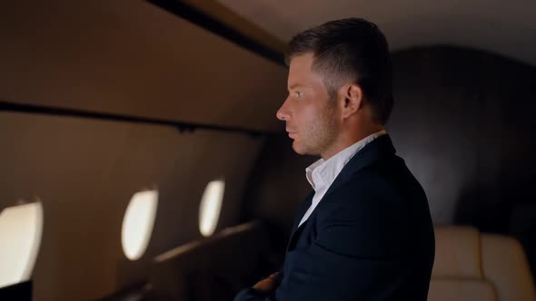 Confident Businessman Portrait in Private Jet.