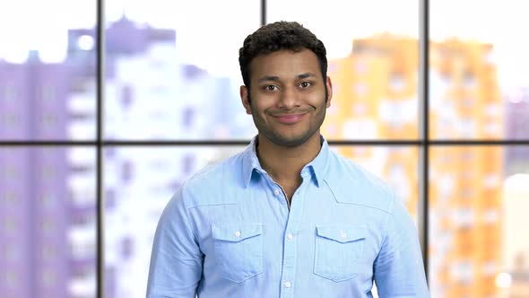 Portrait of a Young Happy Darkskinned Man Wearing Blue Formal Shirt