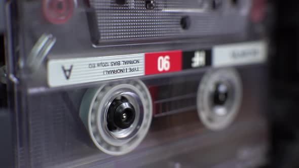 vintage audio cassette begins to play in the tape deck