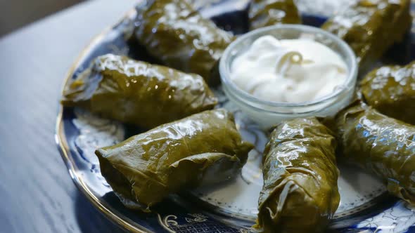 Delicious Dolma with the Cream Sauce on a Asian Plate