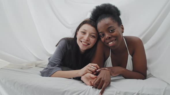 Portrait of Enamored Lesbian Couple in Bed