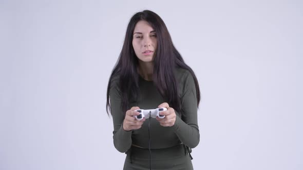 Tired Young Woman Playing Games and Falling Asleep