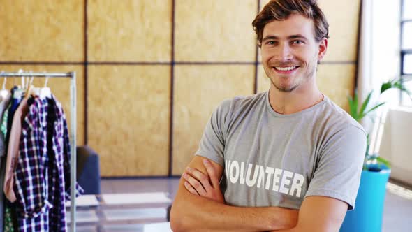 Smiling volunteers pointing to t-shirt