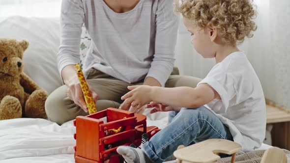 Mother and Baby Playing Zoo alt