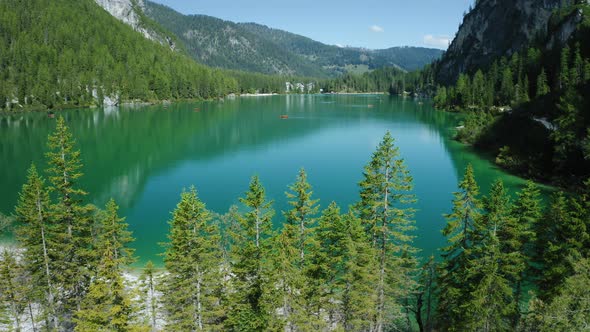 Aerial Footage Over Lake Braies Pragser Wildsee and Mountains in the Background on a Sunny Bright