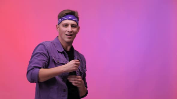 Dancing guy. Studio background. Happy european man dancing.