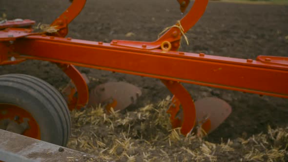 Harvesting in the Field. Land Cultivation with a Tractor