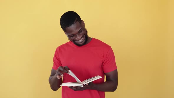 Smart African Guy Reading Book Enjoying Fun Story