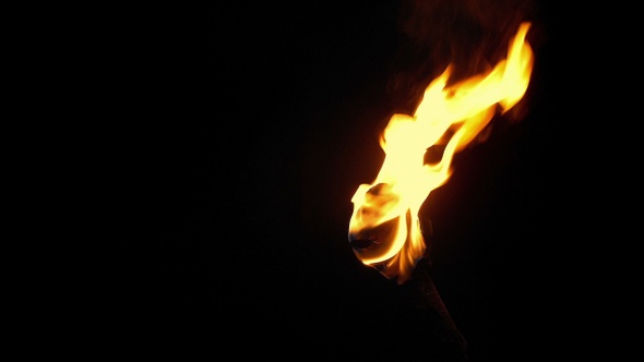 Flaming Torch On Building At Night