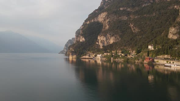 Lake Garda, Northern Italy. Aerial View of Picturesque Coastline, Road on Steep Hills and Calm Water