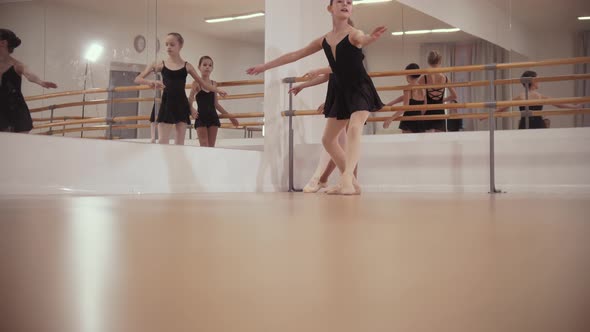 Ballerina Girls in Black Dresses Dancing in the Studio