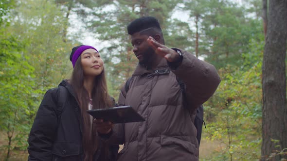 Hikers Couple Using Gps Map Navigation on Tablet Pc