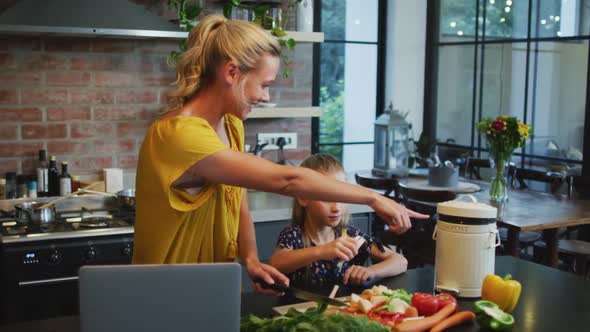 Mother and daughter cooking together