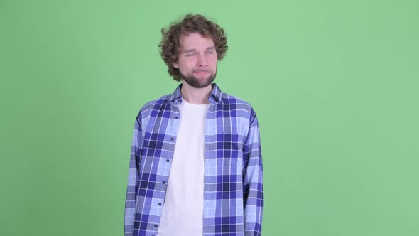 Stressed Young Bearded Hipster Man Looking Bored and Tired