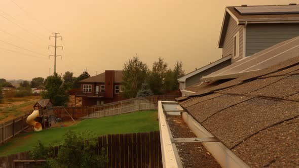 Ashes rain from a smoke filled sky as the Colorado forests burn during 2020 Covid pandemic.