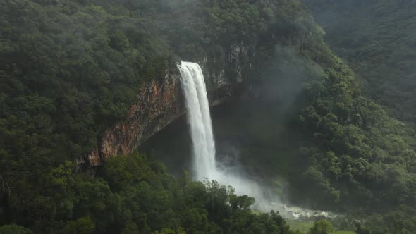 Beautiful Waterfall Among Lush Dense Greenery