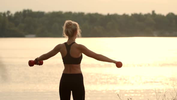 Dumbbells Exercising Workout.Woman Dumbbell Outdoor.Strong Woman Workout Dumbbell.Fit Athletic Girl.