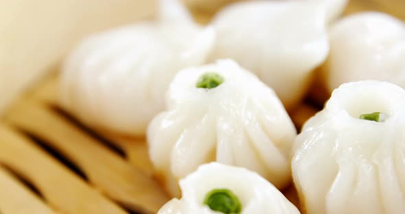 Steamed dumplings in bamboo steamer