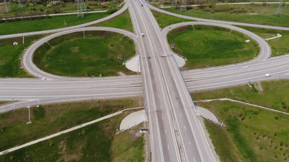 Aerial View of a Suburban Interchange with Few Moving Vehicles