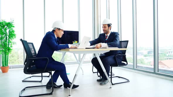 Engineer and Architect Meeting at Office Table