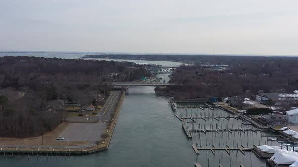 An aerial view over the Shinnecock Canal in Hampton Bays, Long Island, NY. The drone camera dolly in